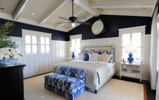 A bedroom with blue and white decor