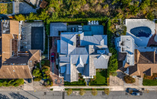A bird 's eye view of a house with many roofs.